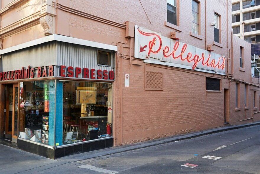 Street view of Italian restaurant with red neon sign